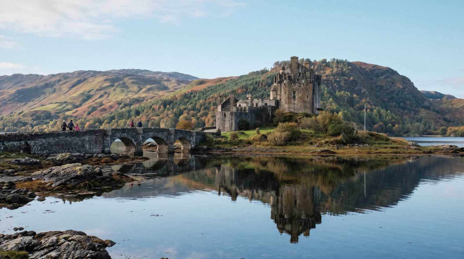 Eilean Donan Castle on its tidal islet with the stone arched footbridge, eilean donan castle
